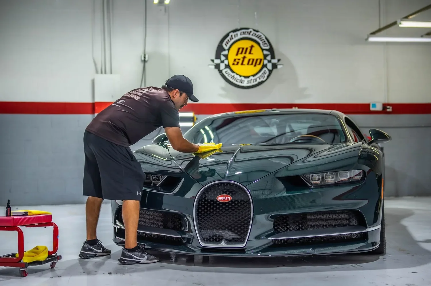 Coated black Bugatti being wiped down at the Scottsdale shop